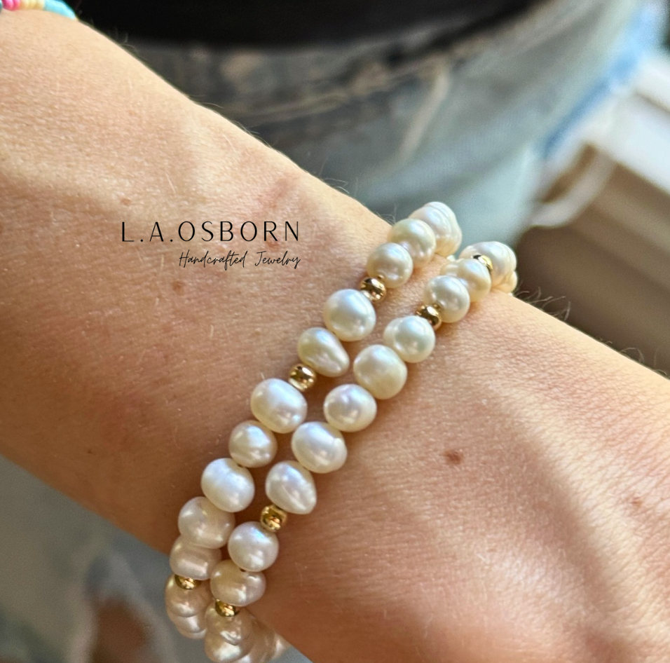 Freshwater_Pearl_Bracelet_2 bracelets in front of. jeans model